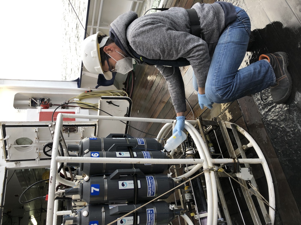 Scientist is filling water into a bottle